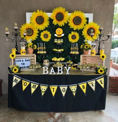 a baby shower with sunflowers and decorations