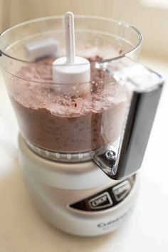 a food processor filled with lots of brownies