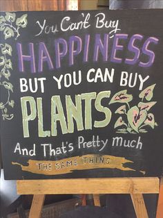 a sign that says you can't buy happiness but you can buy plants and that's pretty much the same thing