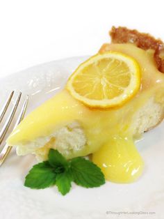 a slice of lemon pie on a plate with a fork