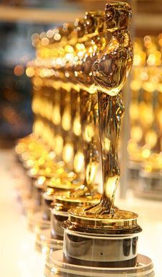 the oscars are lined up in rows with their awards on top of each other