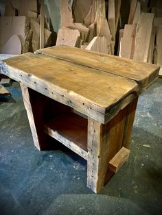 an old wooden table sitting on top of a floor