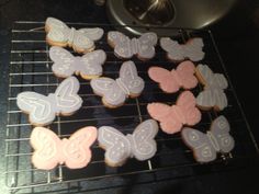 several decorated cookies sitting on top of a cooling rack