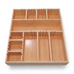 an empty wooden drawer is shown on a white background