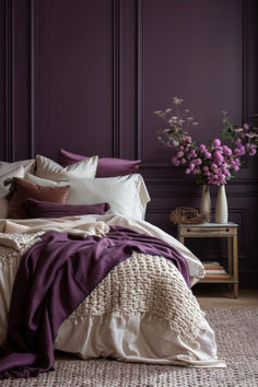 a bedroom with purple walls and white bedding