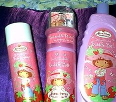 three children's shampoos are sitting next to each other on a purple blanket