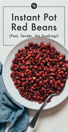 instant pot red beans in a white bowl with a spoon and napkin next to it