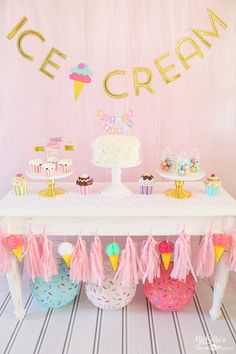 an ice cream themed birthday party with cupcakes, cake and decorations on the table