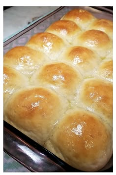 a baking pan filled with bread on top of a table