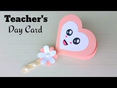 a paper heart shaped card with a flower on it and the words teacher's day card