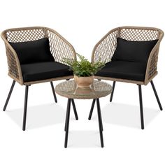 two wicker chairs with black cushions sit next to each other on a glass table