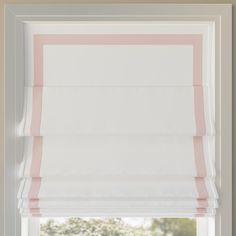 pink and white roman blind in front of a window with the blinds pulled back to reveal an off - white background