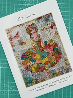 an image of a woman in a colorful dress on a piece of paper