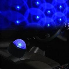 the interior of a car with blue lights