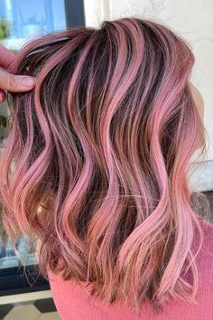 If you're looking to add a little bit of color to your look, why not try out one of the latest pink hair styles? From highlights to full-on pink hair, we've got you covered. So whether you want to go subtle or bold, there's a style for you! #pinkhair #pinkhairstyles #pinkhaircolor #pinkhairides #pinkombrehair #pinkhighlightshair #pinkcoloringhair #longpinkhair #pinkbobhair Peekaboo Hair Color Brunettes Blondes, Brown Hair With Pink Streaks, Summer Hair Dye Ideas, Brown Hair With Pink Highlights, Brown And Pink Hair, Pink Hair Streaks, Pink Hair Highlights, Pink Ombre Hair, Light Pink Hair