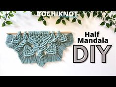 a wall hanging made out of yarn with the words half mandala diy