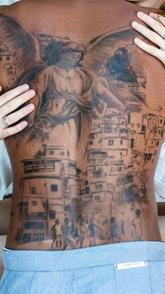 a woman with tattoos on her back