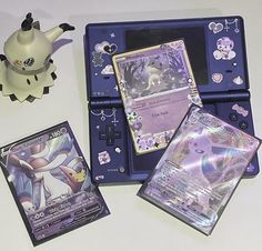 an assortment of pokemon trading cards and accessories