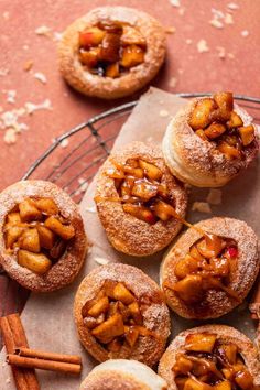 cinnamon rolls with apple filling on a wire rack