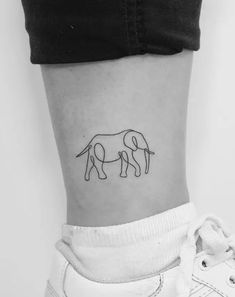 a small elephant tattoo on the ankle