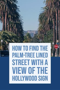 the palm tree lined street with a view of the hollywood sign in blue and white