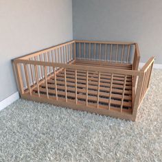 a wooden crib sitting on top of a carpeted floor