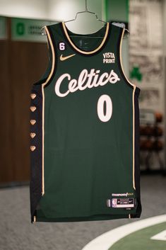 a jersey hanging from a hanger in a basketball uniform store with the name celtius on it