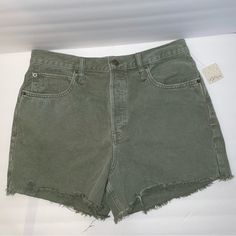 New With Tags Free People We The Free Army Green Distressed Denim Shorts In Size 31. Button Fly. Slits On Sides Of Legs. White Thread At Bottom Of Left Leg. See Photos For Measurements. El Green Shorts With Frayed Hem, Trendy Green Cutoff Jean Shorts, Casual Green Cutoff Jean Shorts, Green Bottoms With Frayed Hem In Short Length, Casual Green Cutoff Shorts, Ripped Green Cotton Bottoms, Green High Waist Bottoms With Frayed Hem, Green High Rise Shorts With Relaxed Fit, High Rise Green Denim Shorts