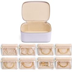 twelve pairs of jewelry in an open case on a white background with clippings