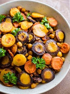 a bowl filled with carrots and other vegetables