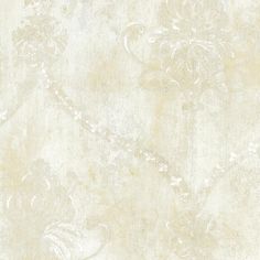 a white wallpaper with an ornate design on it