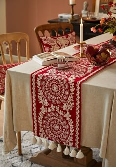 the table is covered with red and white linens