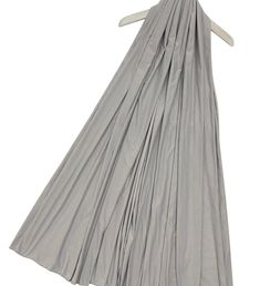 a gray dress on a hanger with white clothes hanging from the top and bottom