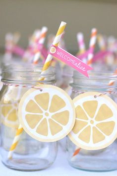 mason jars filled with lemon slices and straws