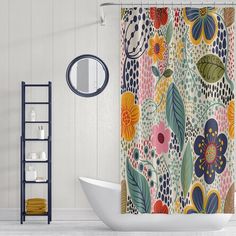 the shower curtain is decorated with colorful flowers