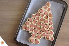 a tray with some food on it and a christmas tree made out of crackers