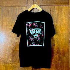 Brand New Vans Tee Black Floral Print Casual T-shirt, Trendy Black Floral Print T-shirt, Casual Black T-shirt With Floral Print, Casual Black Floral Print T-shirt, Black Floral Print Tops For Streetwear, Black Floral Cotton Top, Black Graphic Tee Shirt With Floral Print, Black Graphic Tee With Floral Print, Black Floral Print Graphic Tee Shirt