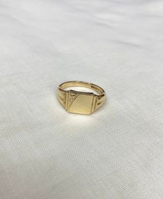 Square Signet Ring 9ct Yellow Gold Hallmarked Birmingham 1967-68 Size - Z Weight - 7.7g If you have any questions, please do not hesitate to send us a message. Packaging  Rings will be presented in a classic black gift box and secured in a padded envelope. Delivery It is our aim to dispatch your order as soon as possible but please note our processing time can take up to 2 weeks. All our items are preowned/preloved unless stated otherwise and with vintage pieces there may be a small amount of natural wear as shown in pictures. We do not accept returns or exchanges under any circumstances. About us We are situated in the heart of Canterbury by the River Stour. You can visit our Canterbury shop for a wider selection of jewellery, watches and unique items.  Follow us on Instagram and Facebook Square Signet Ring, Signet Rings Women Vintage, Signet Rings Women, Rings Women, Gold Signet Ring, Signet Rings, Black Gift Boxes, Black Gift, Canterbury