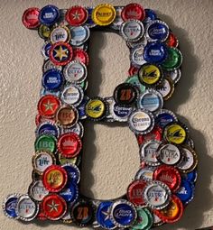 the letter b made out of beer bottle caps