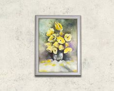 a painting of yellow flowers in a vase on a white wall with a silver frame