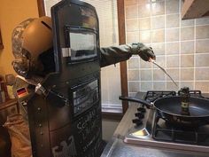 a man is cooking on the stove in his kitchen