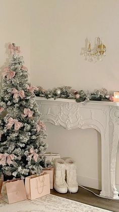 a decorated christmas tree in front of a fireplace