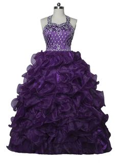 a purple dress on a mannequinl dummy with ruffles and beading