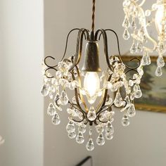 a chandelier hanging from a ceiling in a room