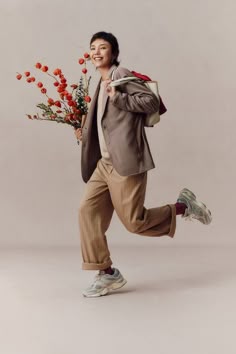 a man is running with flowers in his hand and the caption reads, the 2051 lunar new year collection shop now