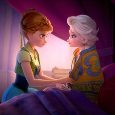 two princesses sitting on a bed looking at each other