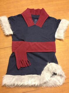 a dress made to look like a costume with fur on the bottom and red sleeves