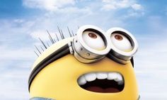 a yellow minion with big eyes and some hair combs on it's head