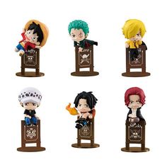 six anime figurines sitting on top of a wooden podium with different colors and designs