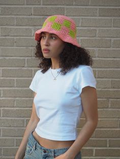 Crochet Pink & Green Checkered Bucket Hat Handmade crochet bucket hat made with 100% cotton yarn. Features pink and green color way with checkered design. Measurements: 8" height, 19" circumference, 1" brim Care Instructions: Hand wash only, lay flat to dry Green Cotton Crochet Bucket Hat, Casual Crochet Mini Hats For Spring, Casual Green Cotton Crochet Hat, Fitted Green Cotton Hat, Fitted Crochet Spring Cap, Fitted Crochet Cap For Spring, Casual Fitted Crochet Hat, Trendy Cotton Crochet Bucket Hat, Fitted Crochet Bucket Hat For Summer